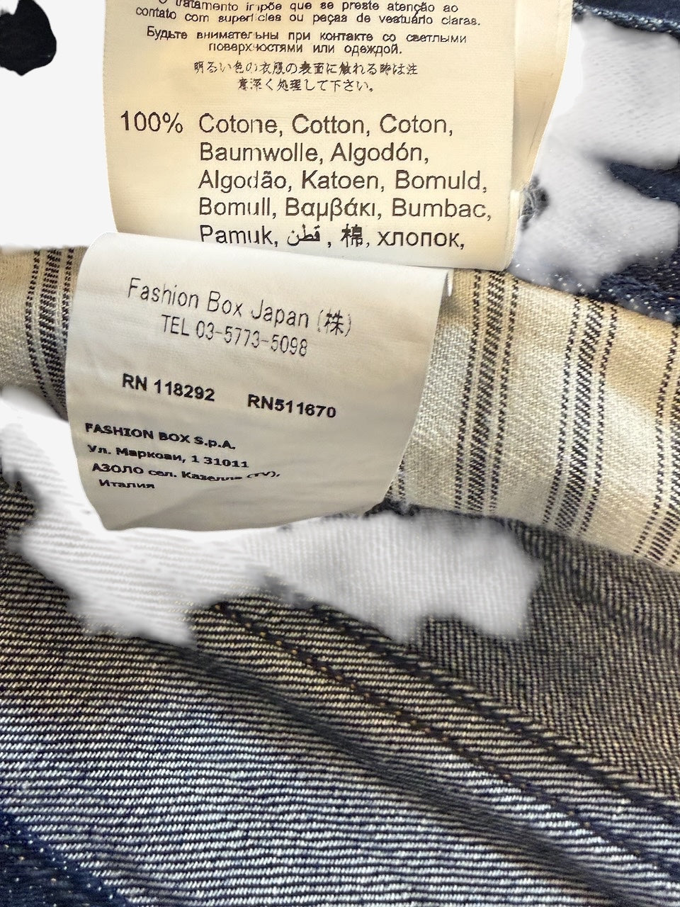 Nordic Jeans Co. REPLAY Newbill denim jeans interior care label showing 100% cotton composition and manufacturer info