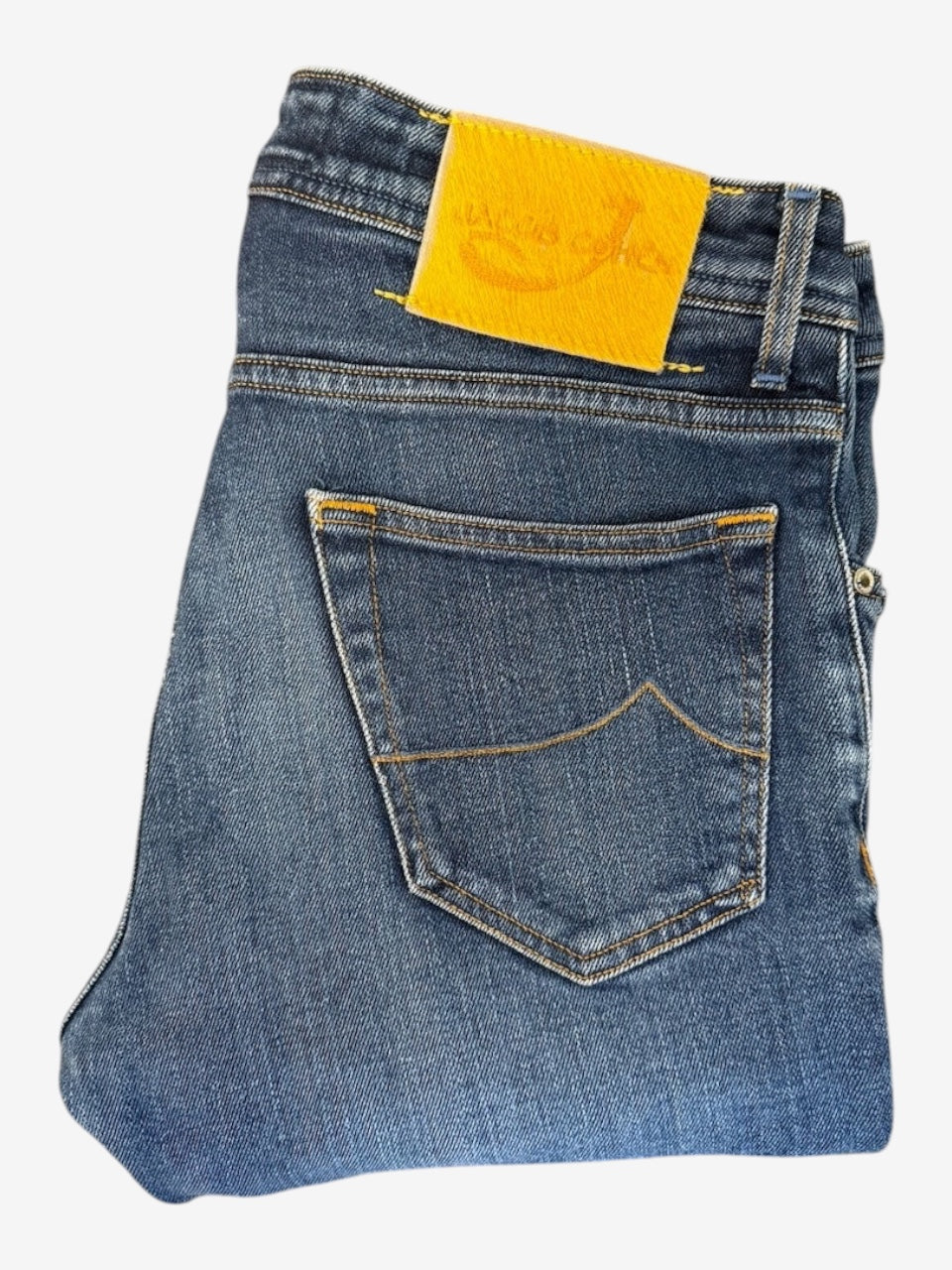 Nordic Jeans Co. JACOB COHËN J622 medium-blue denim jeans featuring a signature yellow back patch and back pocket.