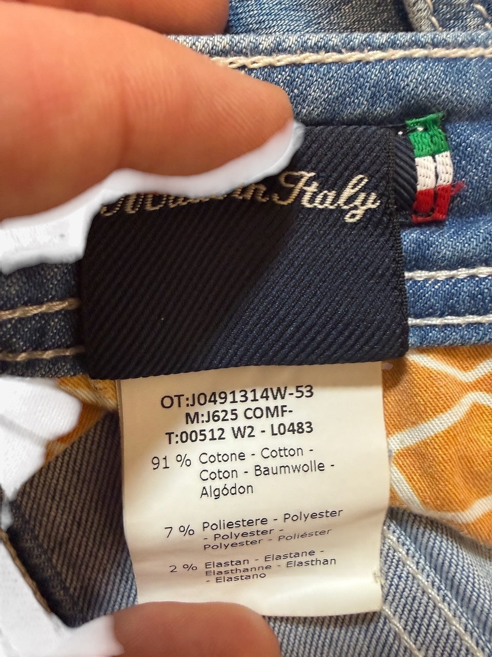 Nordic Jeans Co. Jacob Cohen J625 denim jeans interior label showing Italian craftsmanship and fabric composition