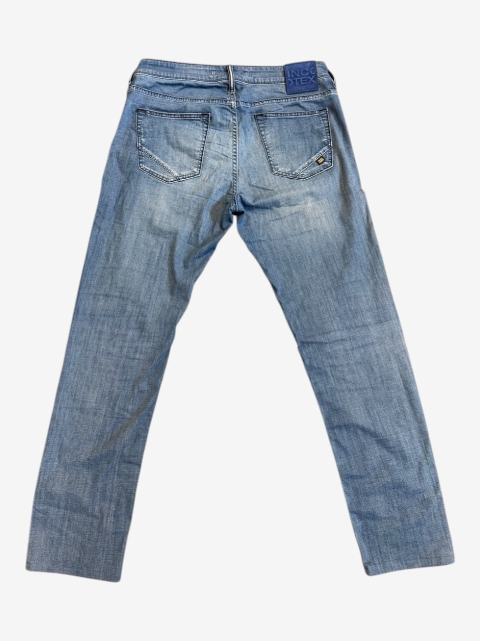 Nordic Jeans Co. Incotex Blue Division light wash denim jeans, back view showing branded patch and five-pocket design.