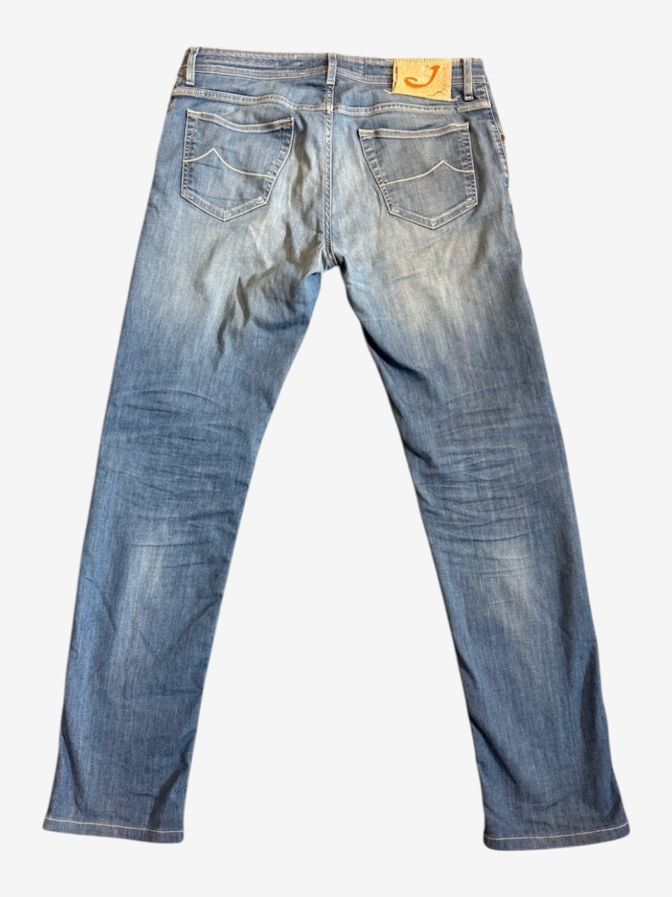 Nordic Jeans Co. Jacob Cohen light-wash tailored denim jeans featuring a signature leather back patch and back pockets.