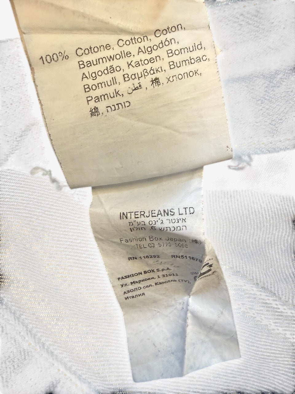 Nordic Jeans Co. REPLAY Waitom denim jeans internal care label showing 100% cotton composition and manufacturer details