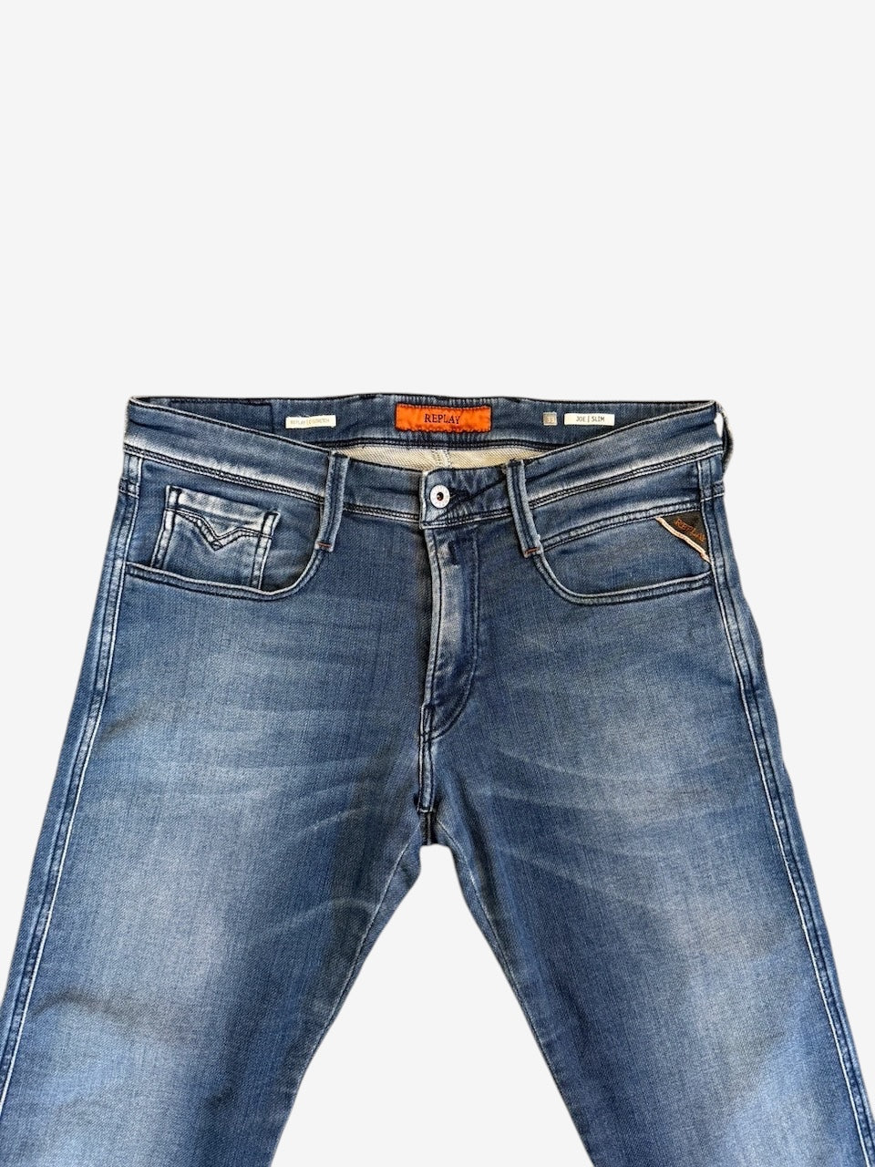 Nordic Jeans Co. REPLAY Joe slim fit denim jeans in a medium-blue wash with subtle fading and branded hardware.