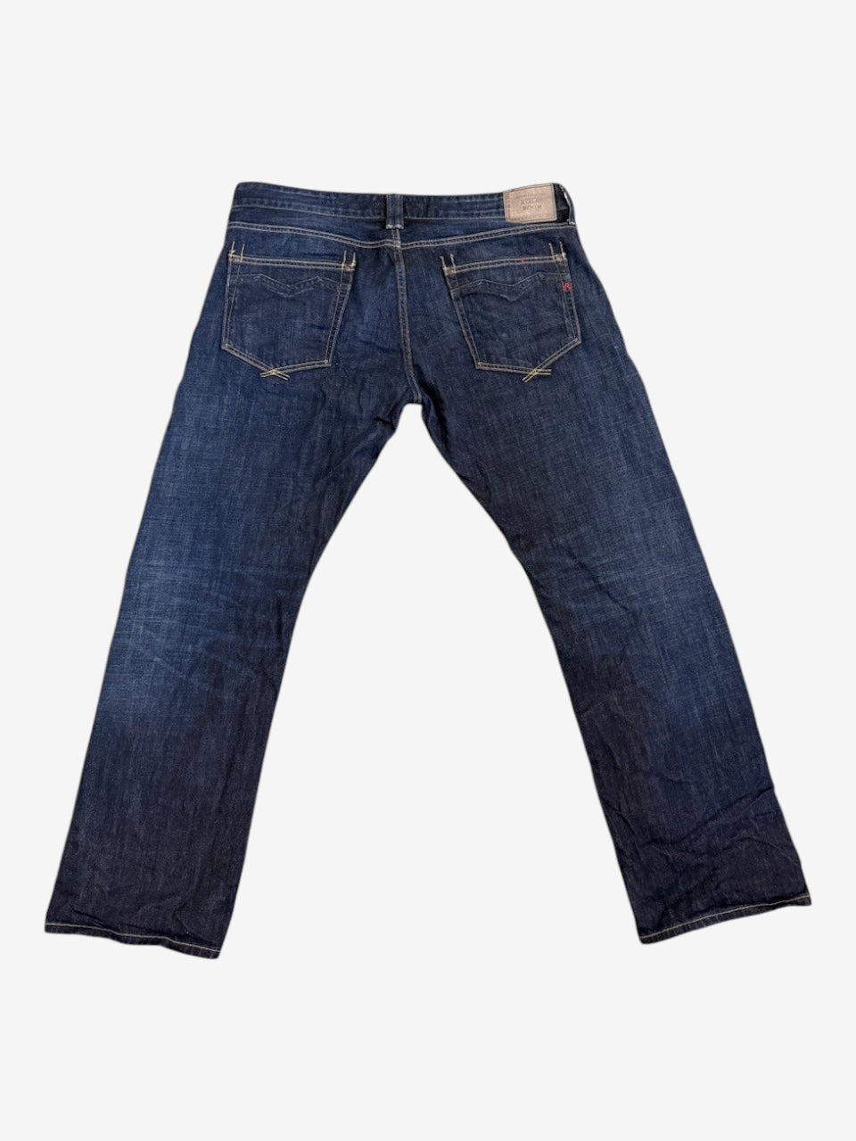 Nordic Jeans Co. REPLAY Newbill regular fit denim jeans in dark indigo wash with back pocket embroidery and logo patch.