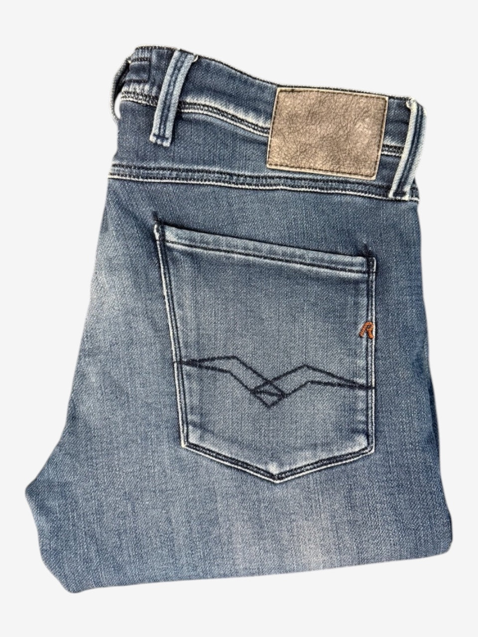 Nordic Jeans Co. REPLAY Joe slim fit denim jeans in a medium-blue wash with signature back pocket stitching.