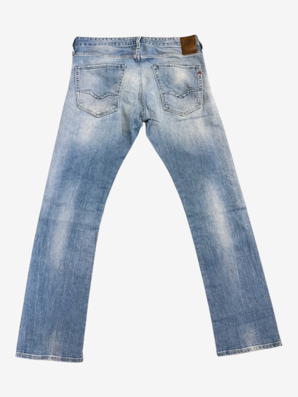 Back view of Nordic Jeans Co. REPLAY Waitom regular fit jeans in light-wash denim with a signature leather back patch.
